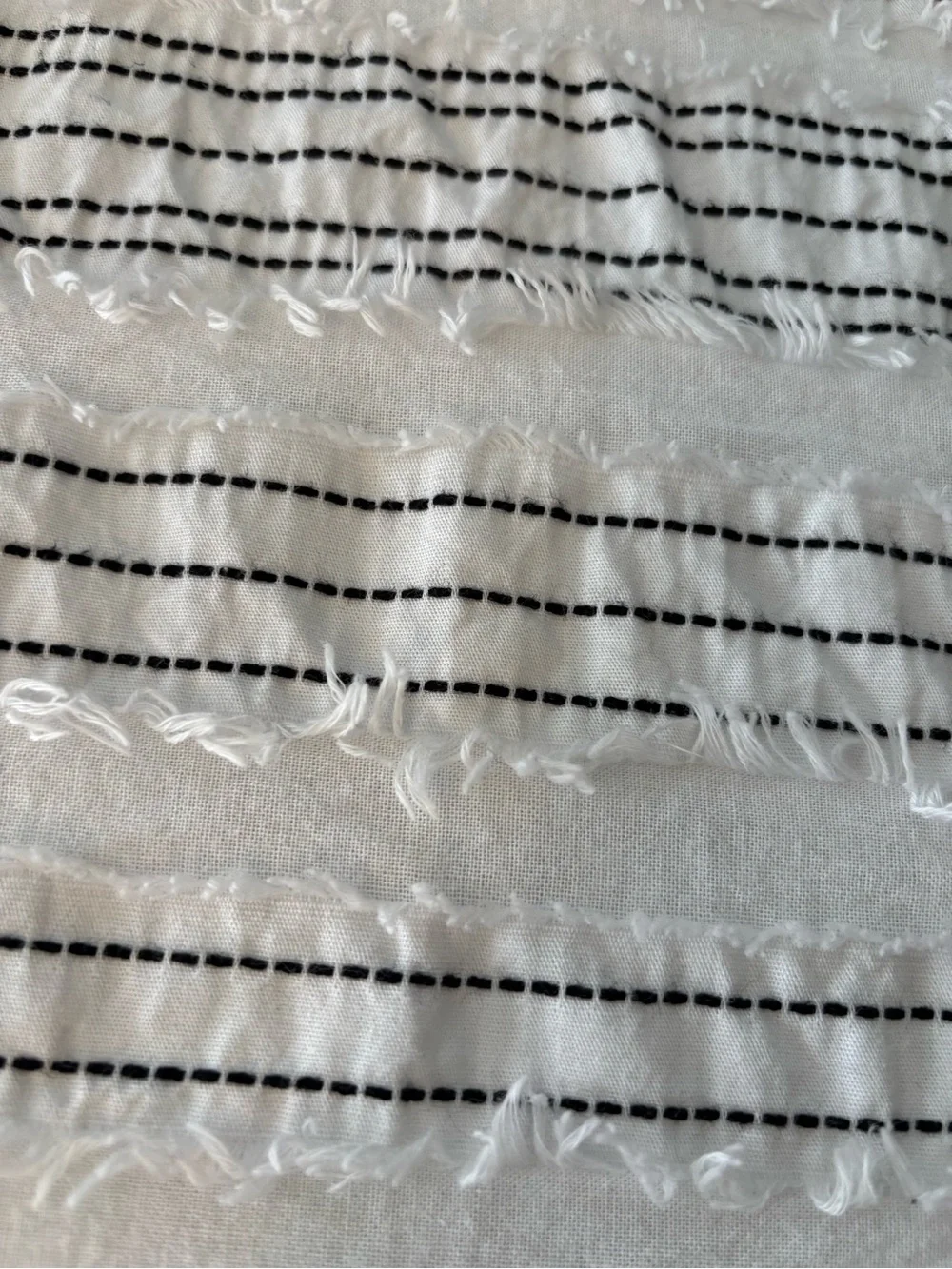 DKNY White Bedspread with Black Striped Bolster Pillows